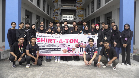 The Shirt-A-Ton charity event team posing with their event banner
